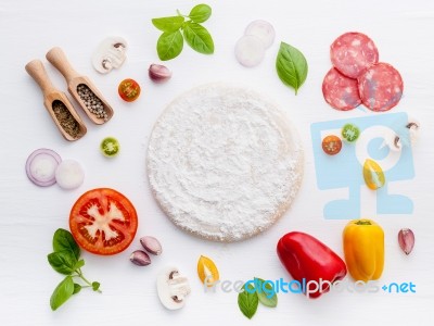 The Ingredients For Homemade Pizza On White Wooden Background Stock Photo