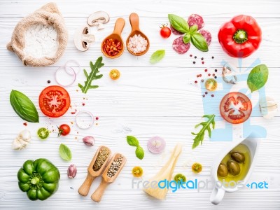 The Ingredients For Homemade Pizza On White Wooden Background Stock Photo