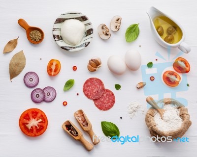 The Ingredients For Homemade Pizza On White Wooden Background Stock Photo