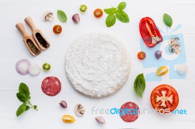 The Ingredients For Homemade Pizza On White Wooden Background Stock Photo