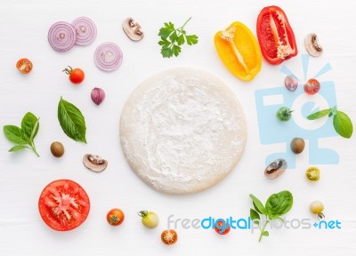 The Ingredients For Homemade Pizza On White Wooden Background Stock Photo