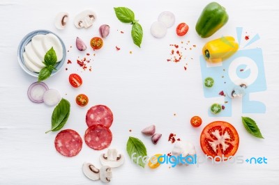 The Ingredients For Homemade Pizza On White Wooden Background Stock Photo