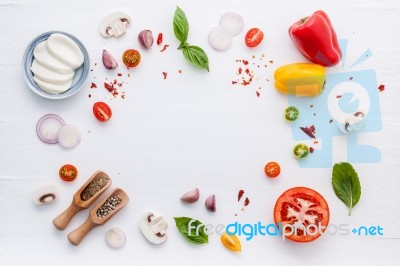 The Ingredients For Homemade Pizza On White Wooden Background Stock Photo