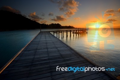 The Landscape Of Beautiful Wooden Bridge With Sunrise Stock Photo