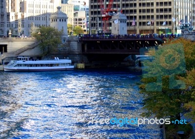 The Magnificent Mile, Michigan Avenue Bridge In Chicago, Viewing The Chicago River As Dyed Blue Stock Photo