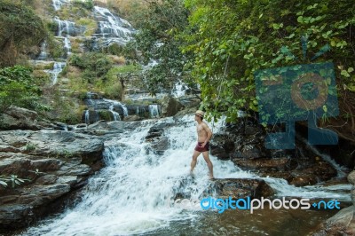 The Man Standing At Mae Ya Waterwall Stock Photo