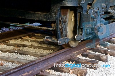 The Old Train Wheels And A Rusty Rail Road Stock Photo