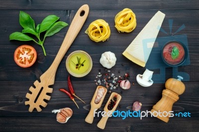 The  Pasta On Black Wooden Background. Yellow Italian Pasta With… Stock Photo