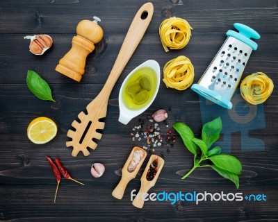 The  Pasta On Black Wooden Background. Yellow Italian Pasta With… Stock Photo