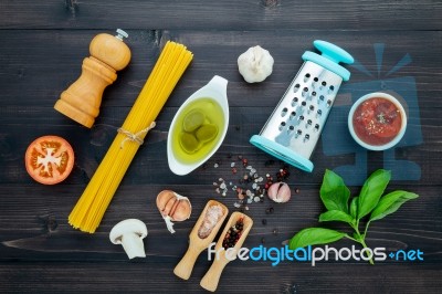 The  Pasta On Black Wooden Background. Yellow Italian Pasta With… Stock Photo