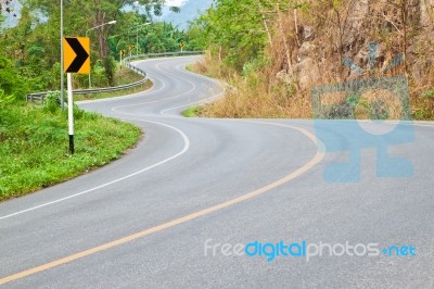 The Road Curves Up The Mountain Stock Photo