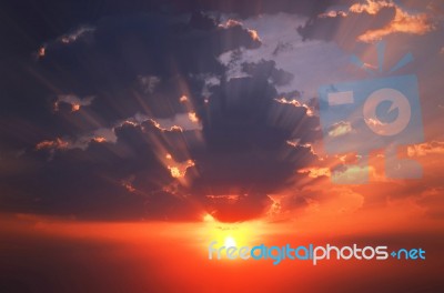 The Sky At Sunset Flaring Background Stock Photo