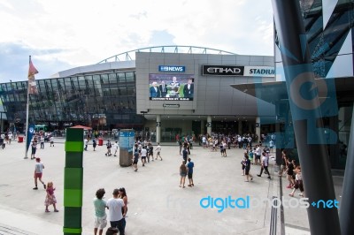 The Soccer Fans In Front Of Ethihad Stadium Stock Photo