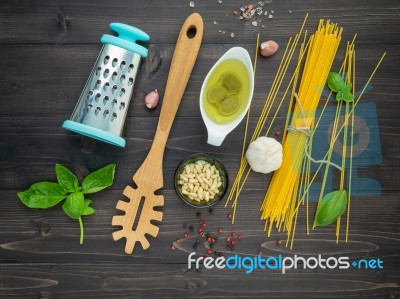 The Thin Spaghetti On Black Wooden Background. Yellow Italian Pa… Stock Photo