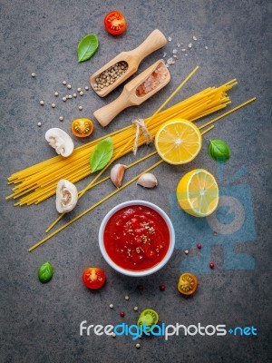 The Thin Spaghetti On Dark Stone Background. Yellow Italian Past… Stock Photo