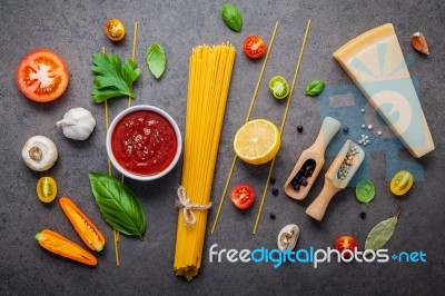 The Thin Spaghetti On Dark Stone Background. Yellow Italian Past… Stock Photo