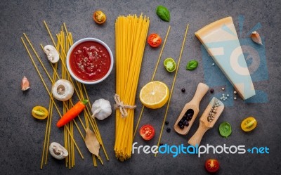 The Thin Spaghetti On Dark Stone Background. Yellow Italian Past… Stock Photo