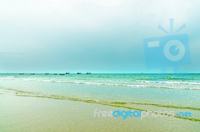 The View Of Sand Beach And Sea Wave On Afternoon Stock Photo