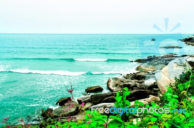 The View Of The Sand Beach And Sea Wave On The Afternoon Stock Photo