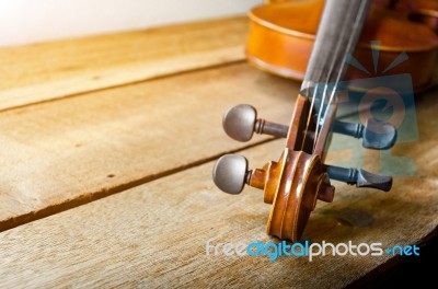 The Violin On The Table, Close Up Of Violin On The Wooden Floor Stock Photo