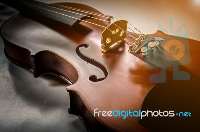 The Violin On The Table, Close Up Of Violin On The Wooden Floor Stock Photo