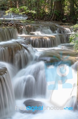 The Water Flowing Over Rocks And Trees Down A Waterfall At Huay Mae Khamin Waterfall National Park ,kanchana Buri In Thailand Stock Photo