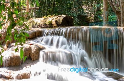 The Water Flowing Over Rocks And Trees Down A Waterfall At Huay Mae Khamin Waterfall National Park ,kanchana Buri In Thailand Stock Photo