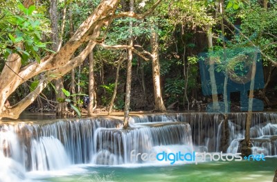 The Water Flowing Over Rocks And Trees Down A Waterfall At Huay Mae Khamin Waterfall National Park ,kanchana Buri In Thailand Stock Photo