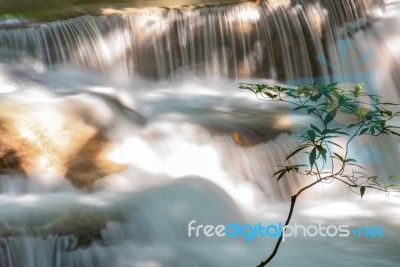 The Water Flowing Over Rocks And Trees Down A Waterfall At Huay Mae Khamin Waterfall National Park ,kanchana Buri In Thailand Stock Photo