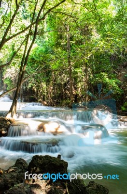 The Water Flowing Over Rocks And Trees Down A Waterfall At Huay Mae Khamin Waterfall National Park ,kanchana Buri In Thailand Stock Photo