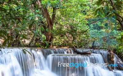 The Water Flowing Over Rocks And Trees Down A Waterfall At Huay Mae Khamin Waterfall National Park ,kanchana Buri In Thailand Stock Photo