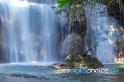 The Water Flowing Over Rocks And Trees Down A Waterfall At Huay Mae Khamin Waterfall National Park ,kanchana Buri In Thailand Stock Photo