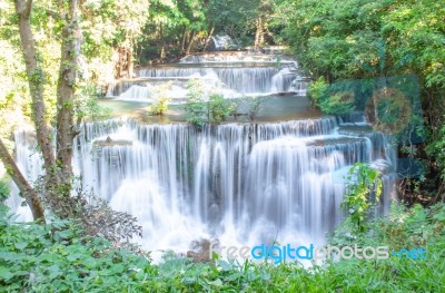 The Water Flowing Over Rocks And Trees Down A Waterfall At Huay Mae Khamin Waterfall National Park ,kanchana Buri In Thailand Stock Photo