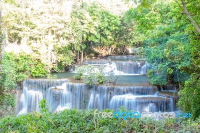 The Water Flowing Over Rocks And Trees Down A Waterfall At Huay Mae Khamin Waterfall National Park ,kanchana Buri In Thailand Stock Photo