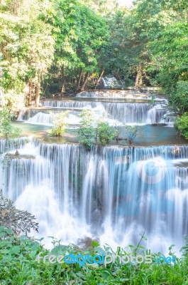 The Water Flowing Over Rocks And Trees Down A Waterfall At Huay Mae Khamin Waterfall National Park ,kanchana Buri In Thailand Stock Photo