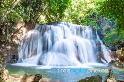 The Water Flowing Over Rocks And Trees Down A Waterfall At Huay Mae Khamin Waterfall National Park ,kanchana Buri In Thailand Stock Photo