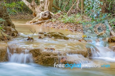 The Water Flowing Over Rocks And Trees Down A Waterfall At Huay Mae Khamin Waterfall National Park ,kanchana Buri In Thailand Stock Photo