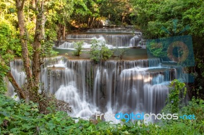 The Water Flowing Over Rocks And Trees Down A Waterfall At Huay Mae Khamin Waterfall National Park ,kanchana Buri In Thailand Stock Photo