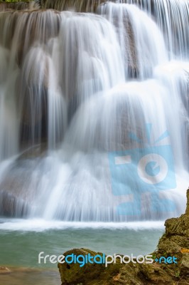 The Water Flowing Over Rocks And Trees Down A Waterfall At Huay Mae Khamin Waterfall National Park ,kanchana Buri In Thailand Stock Photo