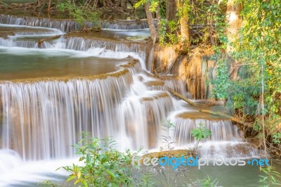 The Water Flowing Over Rocks And Trees Down A Waterfall At Huay Mae Khamin Waterfall National Park ,kanchana Buri In Thailand Stock Photo