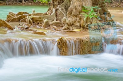 The Water Flowing Over Rocks And Trees Down A Waterfall At Huay Mae Khamin Waterfall National Park ,kanchana Buri In Thailand Stock Photo