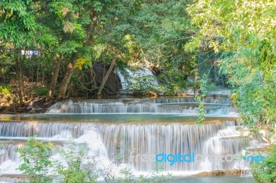 The Water Flowing Over Rocks And Trees Down A Waterfall At Huay Mae Khamin Waterfall National Park ,kanchana Buri In Thailand Stock Photo