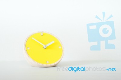 The Yellow Clock And White Background Stock Photo