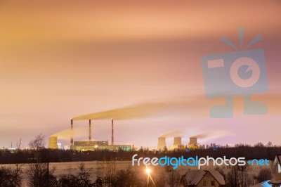 Thermal Power Plant And Cooling Towers At Night Stock Photo