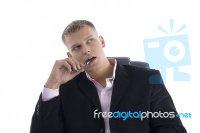 Thinking Young Manager Looking Up Stock Photo