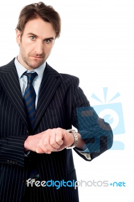 This Is The Right Time! Serious Businessman Stock Photo