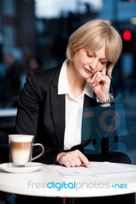 Thoughtful Business Woman In Cafe Stock Photo