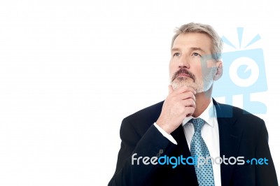 Thoughtful Senior Male Executive Stock Photo