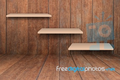 Three Brown Shelves On Wooden Interior Texture Background Stock Photo