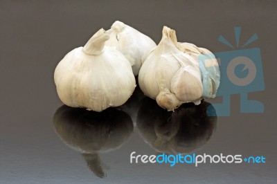 Three Garlic Bulbs Stock Photo